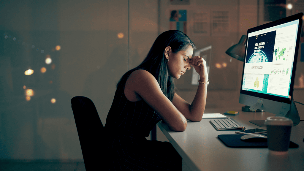 tired woman sitting at desk